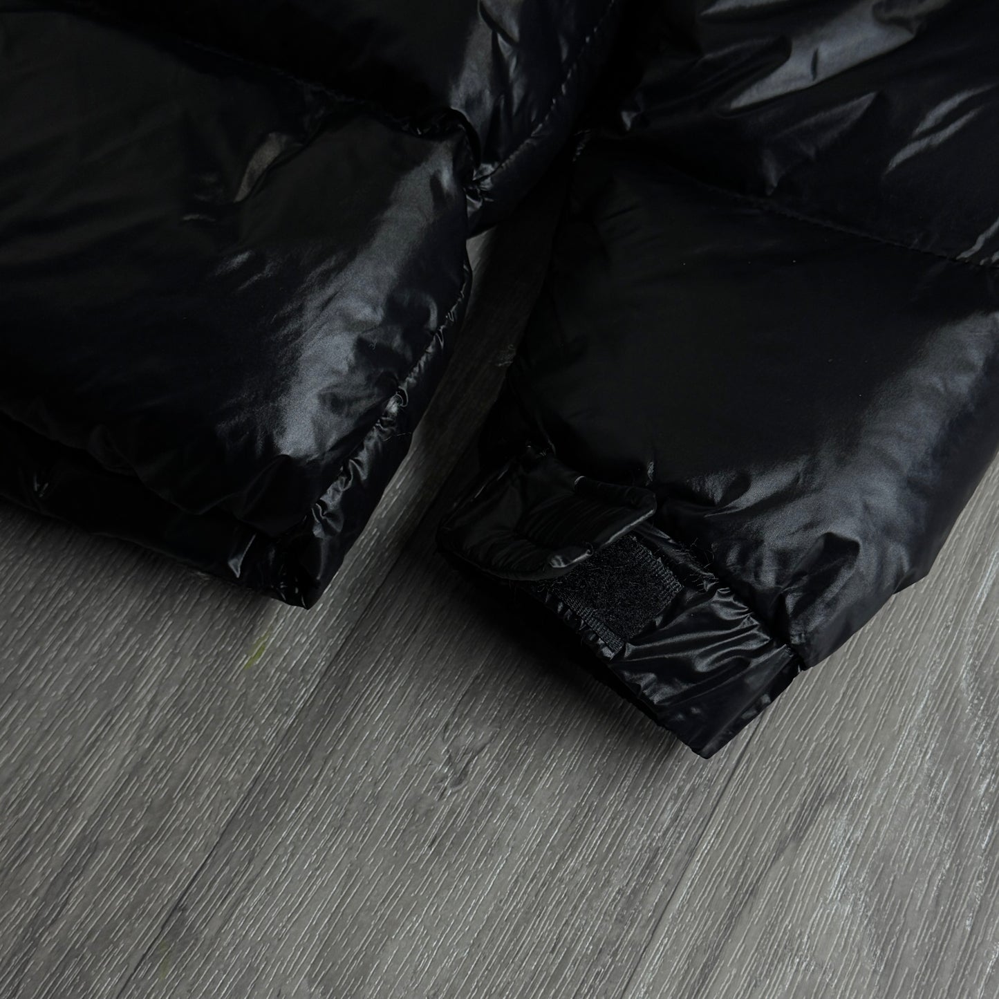 NIKE NOCTA GLOSSY PUFFER JACKET BLACK