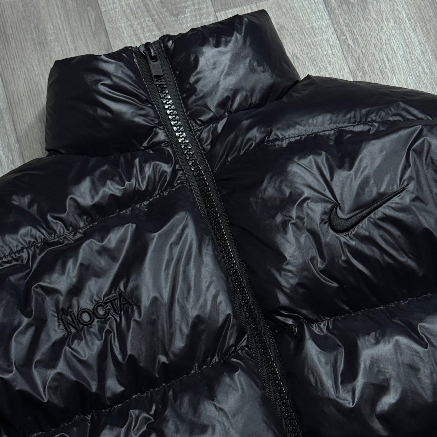 NIKE NOCTA GLOSSY PUFFER JACKET BLACK