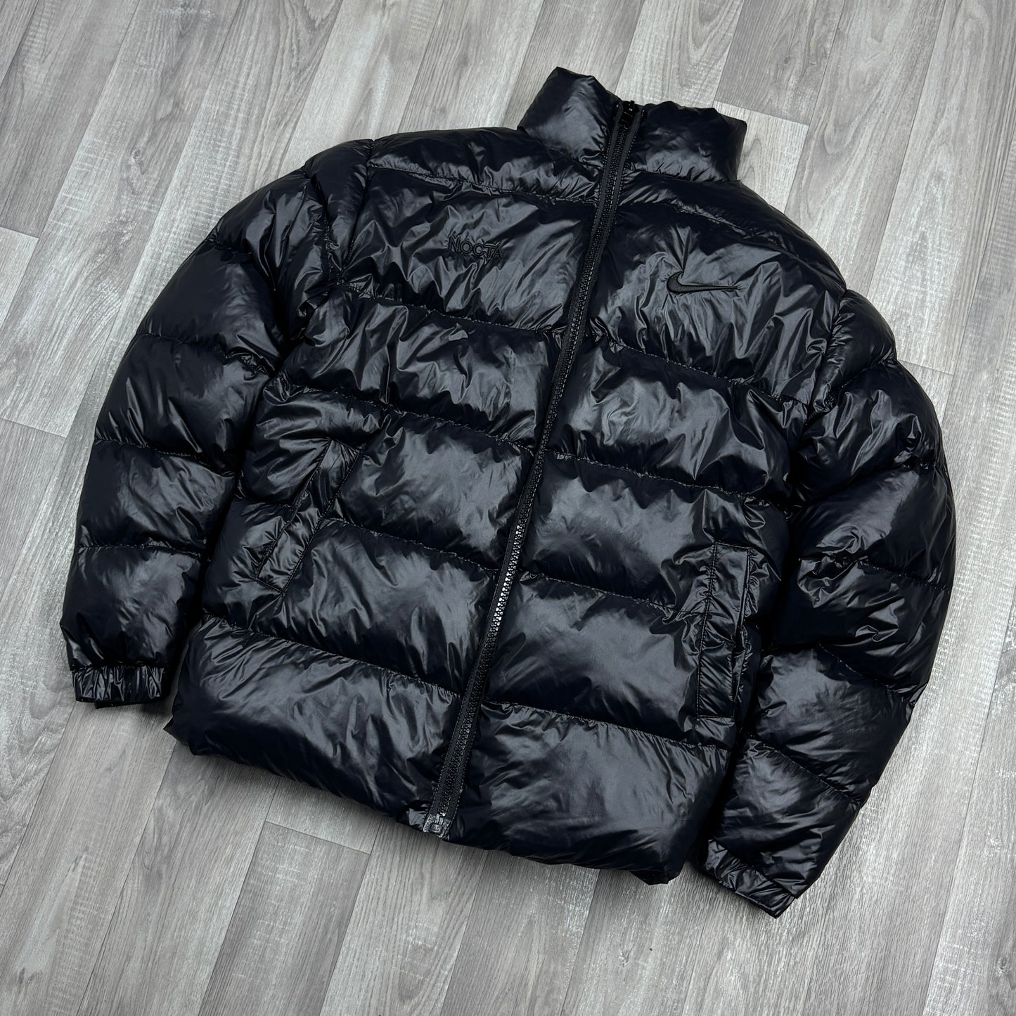 NIKE NOCTA GLOSSY PUFFER JACKET BLACK